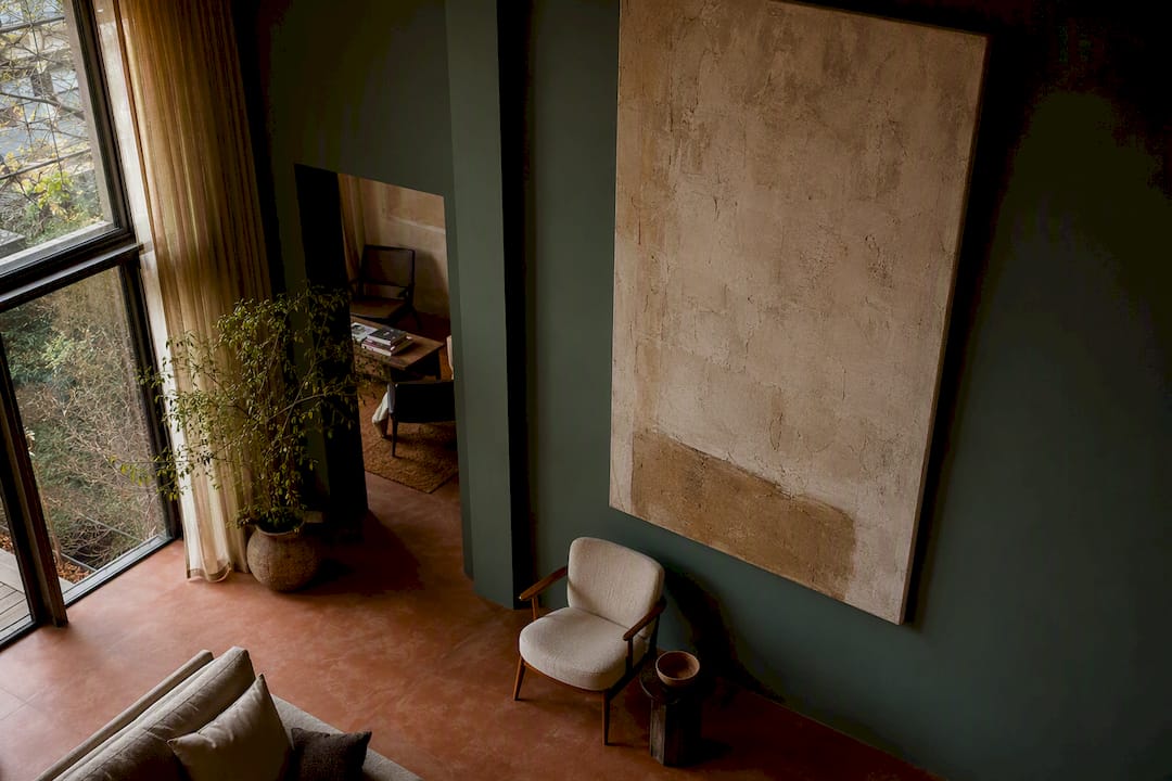Tall living room wall with large framed art