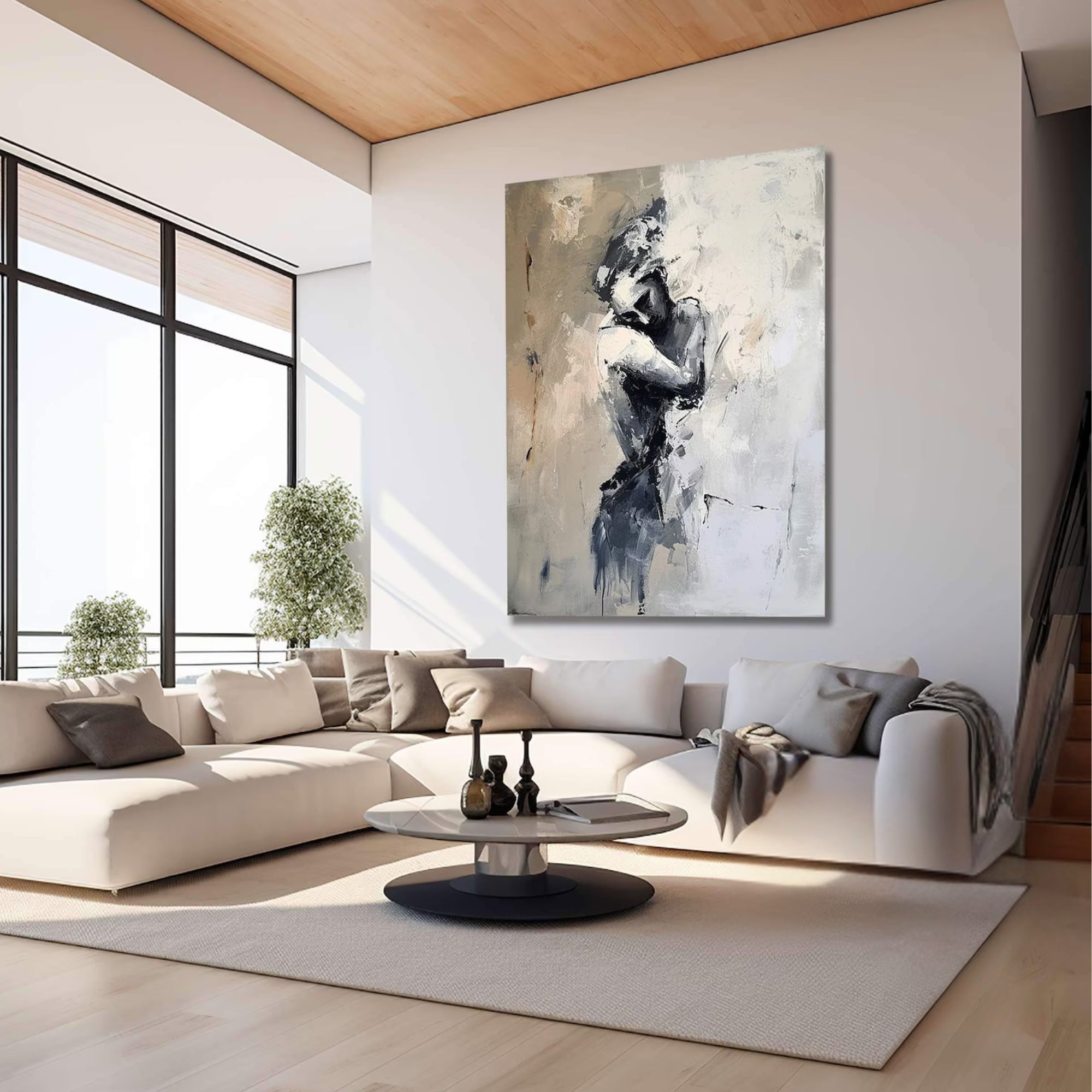 Romantic abstract figure painting with dramatic contrast, mounted on a textured grey wall beside a bronze seated sculpture.