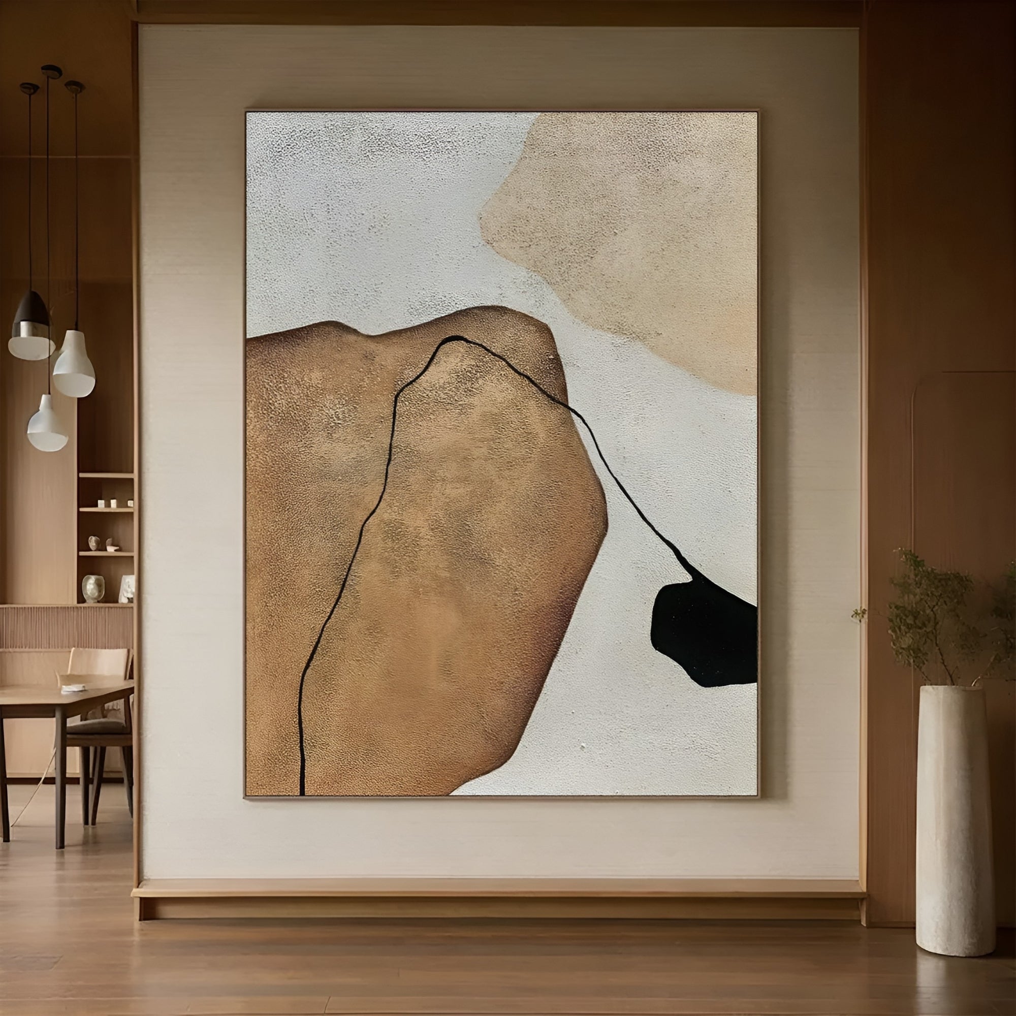 Modern abstract wall art with fluid black and brown lines on canvas, creating a striking focal point in a minimalist home.