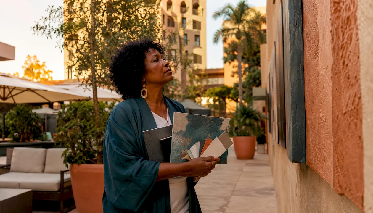 Art consultant selecting artwork in corporate lobby