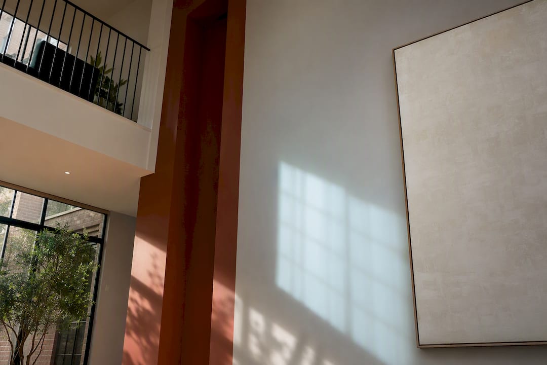 Large canvas edge beside tall wall