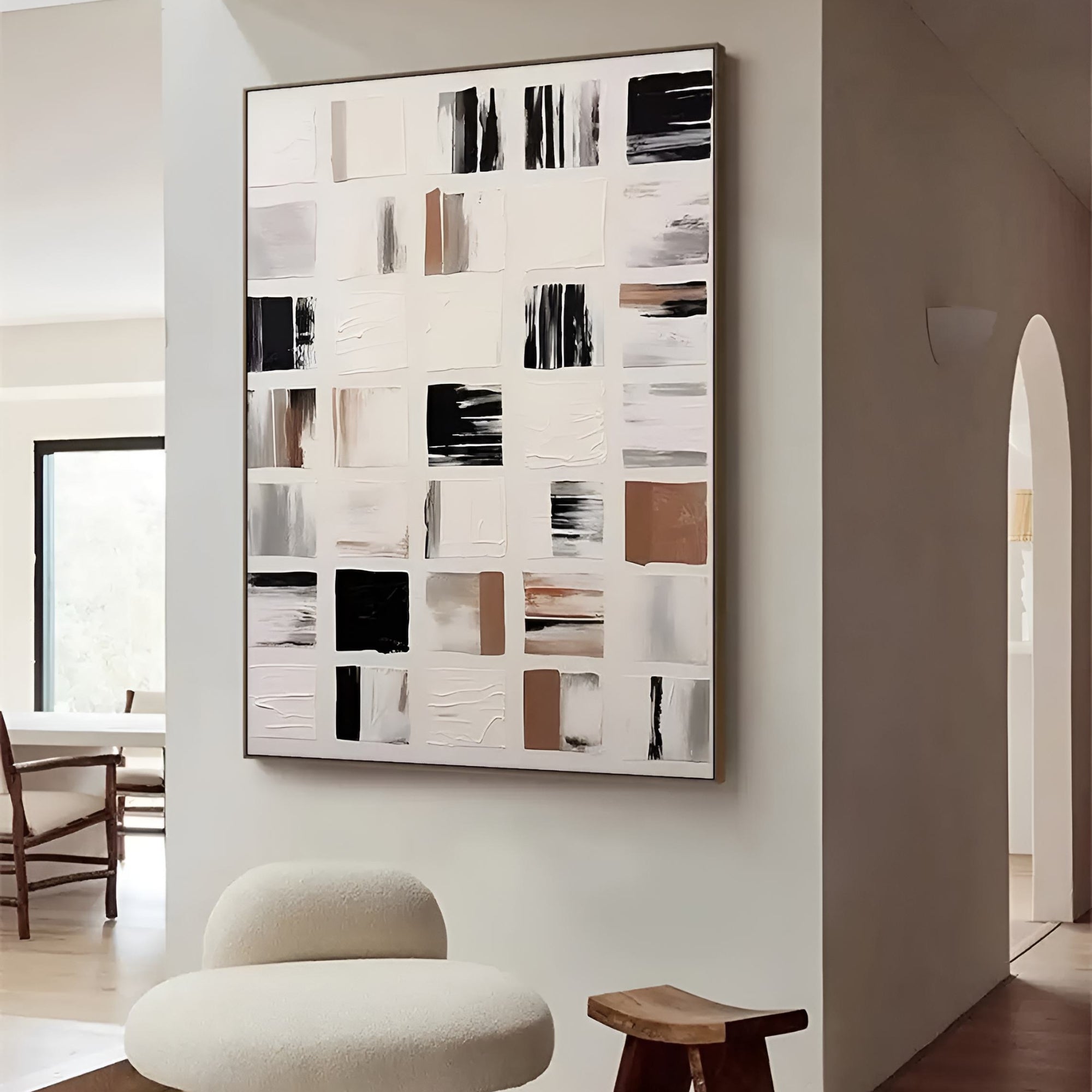 Geometric wall art with a grid layout of expressive, hand-painted blocks in earthy hues and monochrome, perfect for adding sophistication to a Scandinavian or Japandi-style setting.