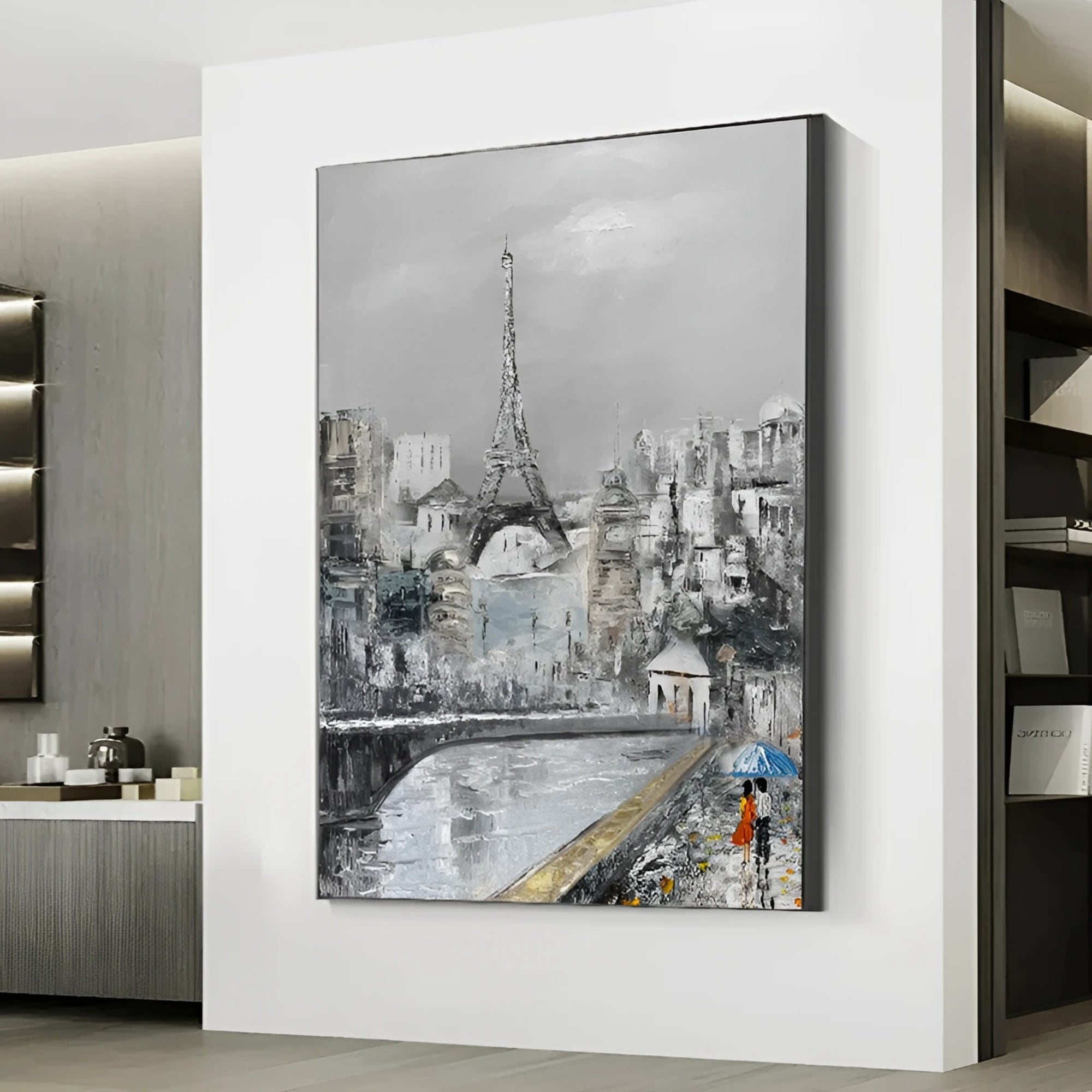 Paris street scene painting with the Eiffel Tower in the background – A romantic oil painting featuring a moody gray palette, accented by a lone figure with a blue umbrella walking along the Seine. Perfect for hallways, entryways, or bedrooms for a cozy, elegant feel.