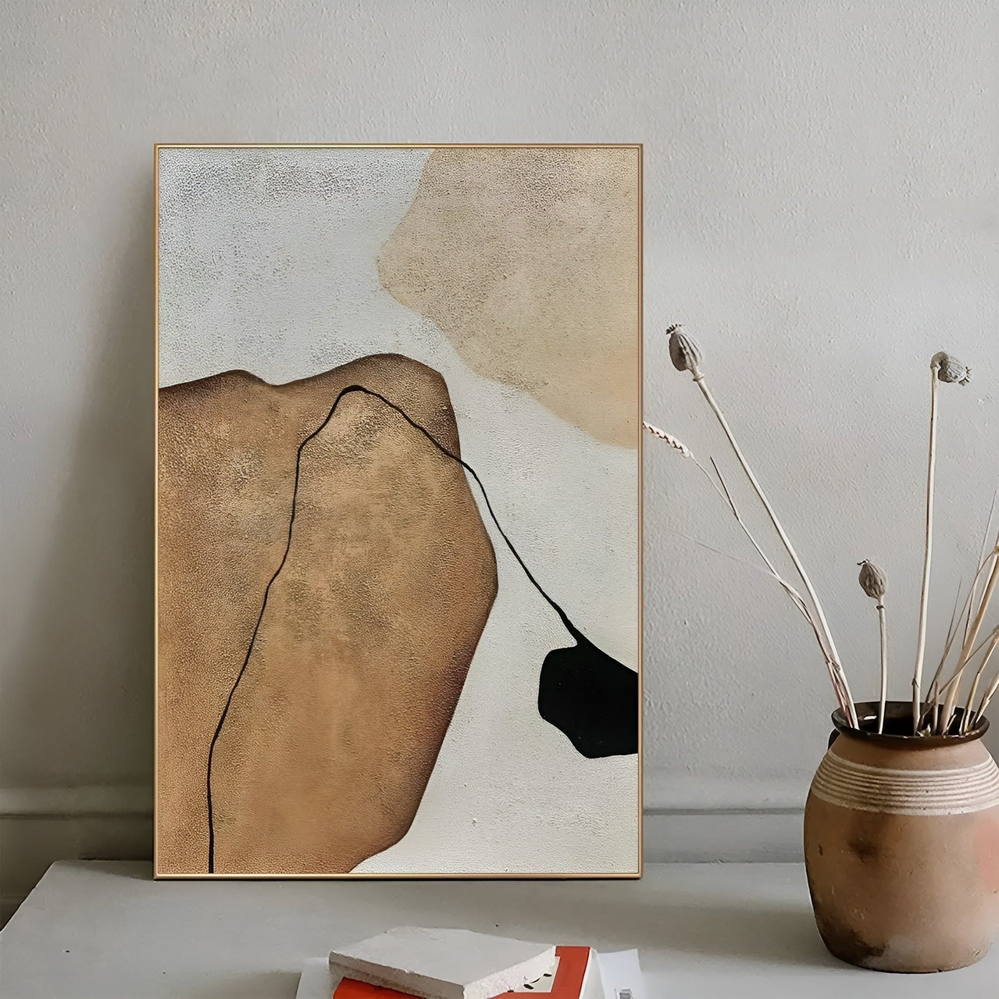 Large abstract painting with earthy brown, beige, and black tones, adding a modern artistic touch to a contemporary interior.