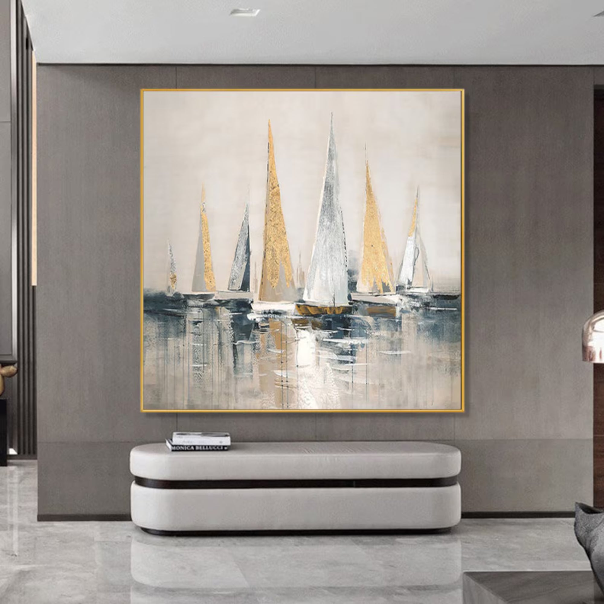 Elegant sailboat painting with soft golden tones, adding a serene coastal feel to this stylish dining area.