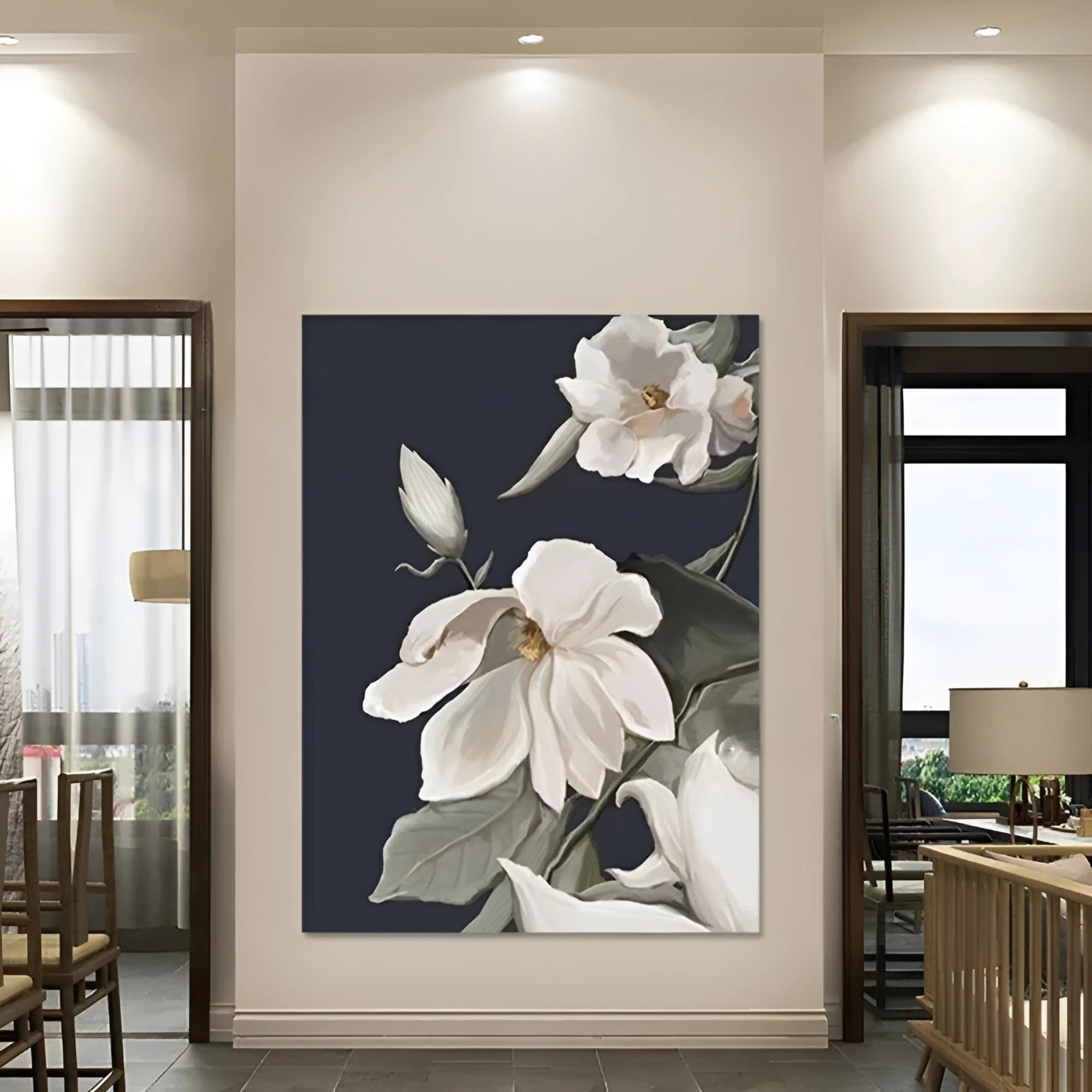 Elegant floral artwork featuring white magnolia blooms against a deep charcoal background, adding sophistication to a bright office corner filled with greenery.