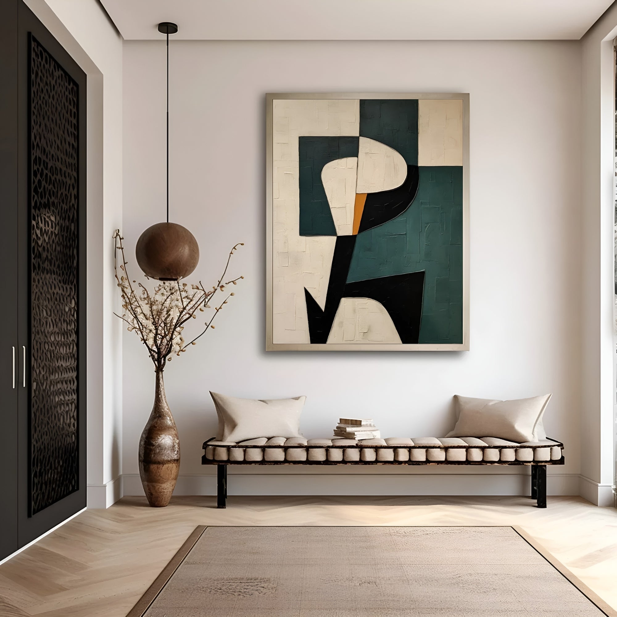A geometric abstract hand-painted wall art in shades of green and beige displayed above a bench in a room with minimalist decor.