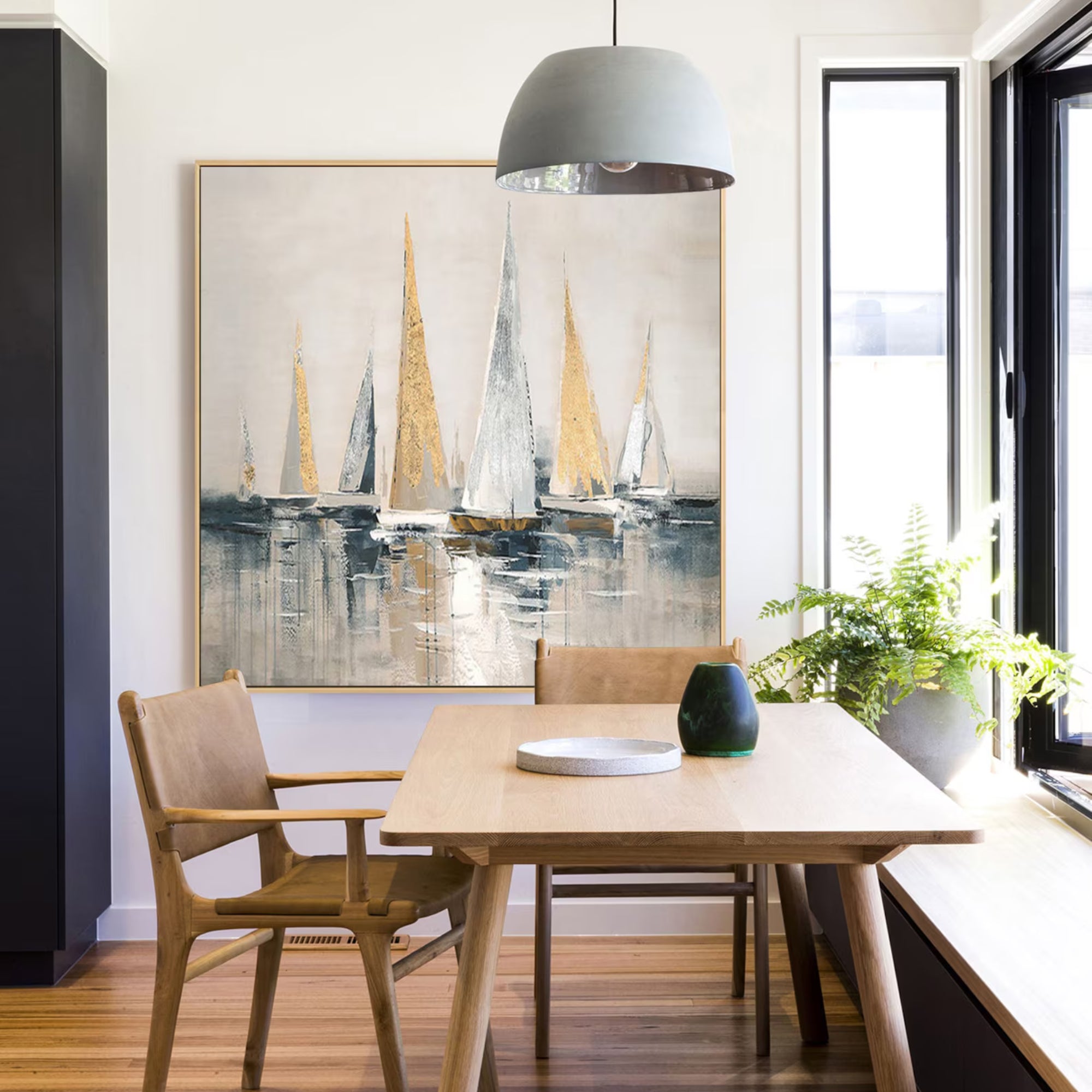 Modern sailboat artwork with textured strokes, creating nautical charm in a contemporary interior.