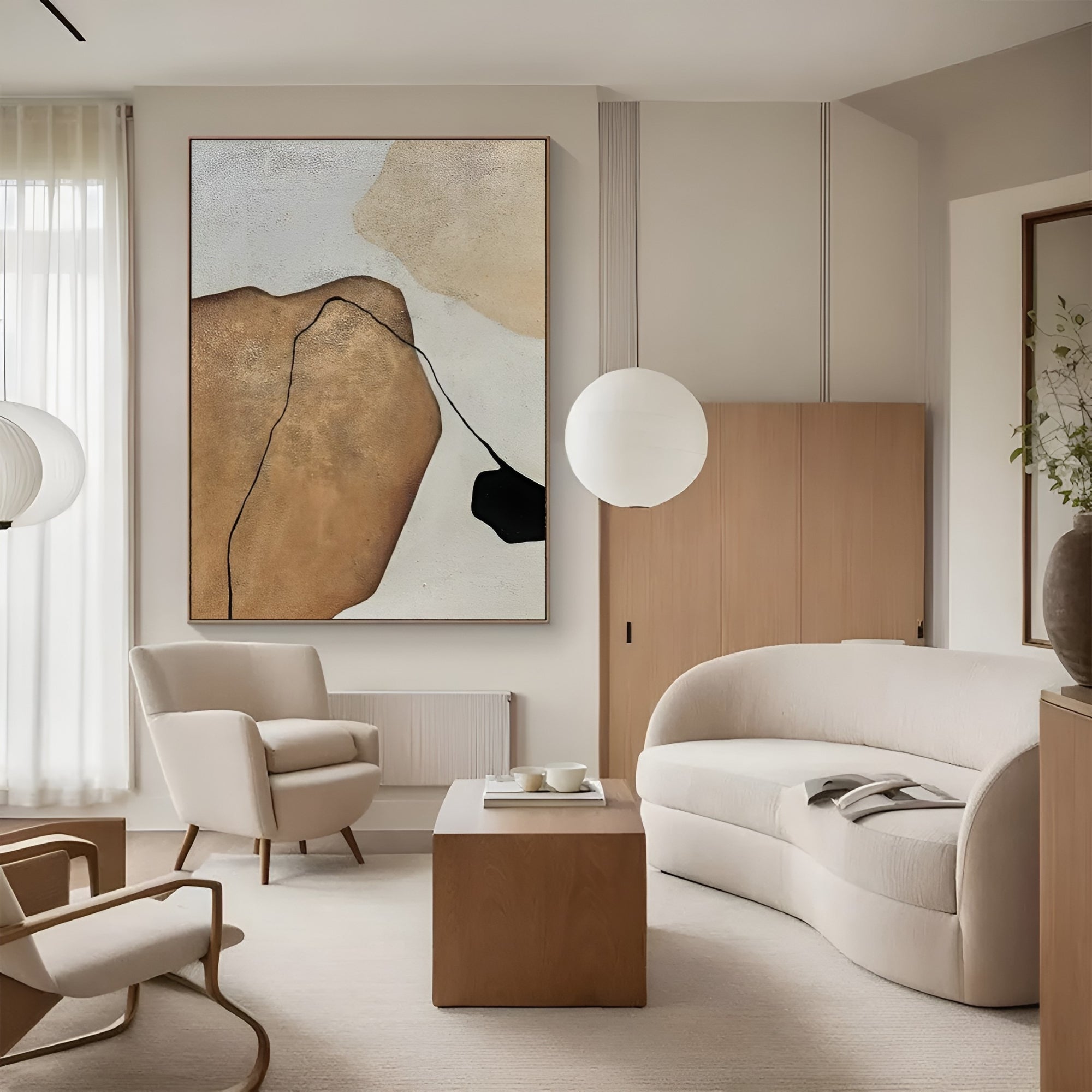 Minimalist abstract oil painting with earthy tones and black accents in a modern living room, enhancing the warm, neutral decor.