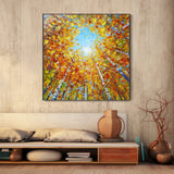 Abstract autumn forest painting featuring tall trees with fiery orange, red, and yellow foliage reaching toward a soft blue sky, creating an immersive upward perspective. Ideal for cozy living rooms or creative studio spaces.