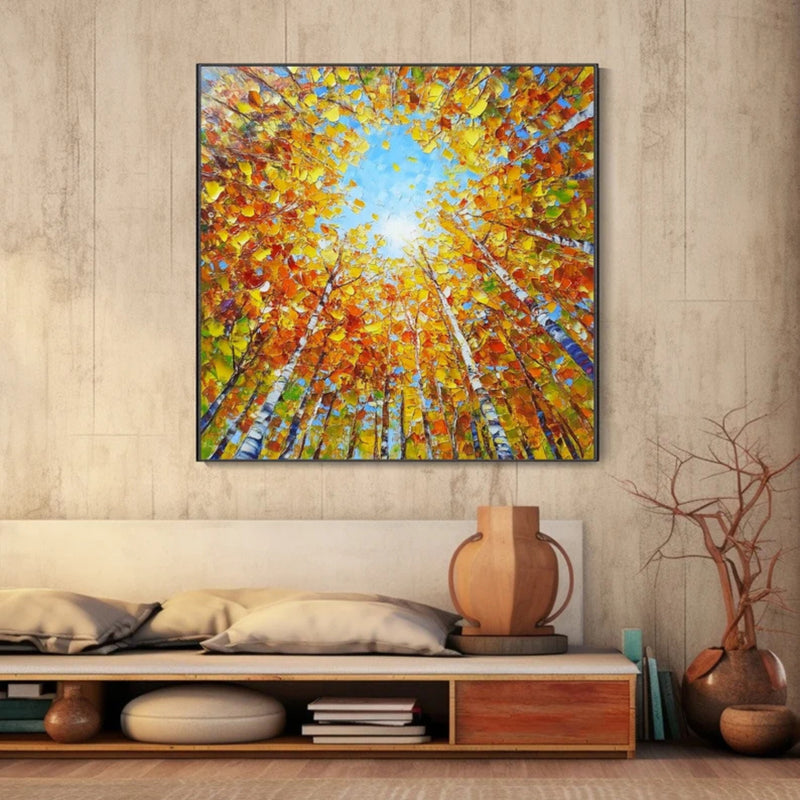 Abstract autumn forest painting featuring tall trees with fiery orange, red, and yellow foliage reaching toward a soft blue sky, creating an immersive upward perspective. Ideal for cozy living rooms or creative studio spaces.