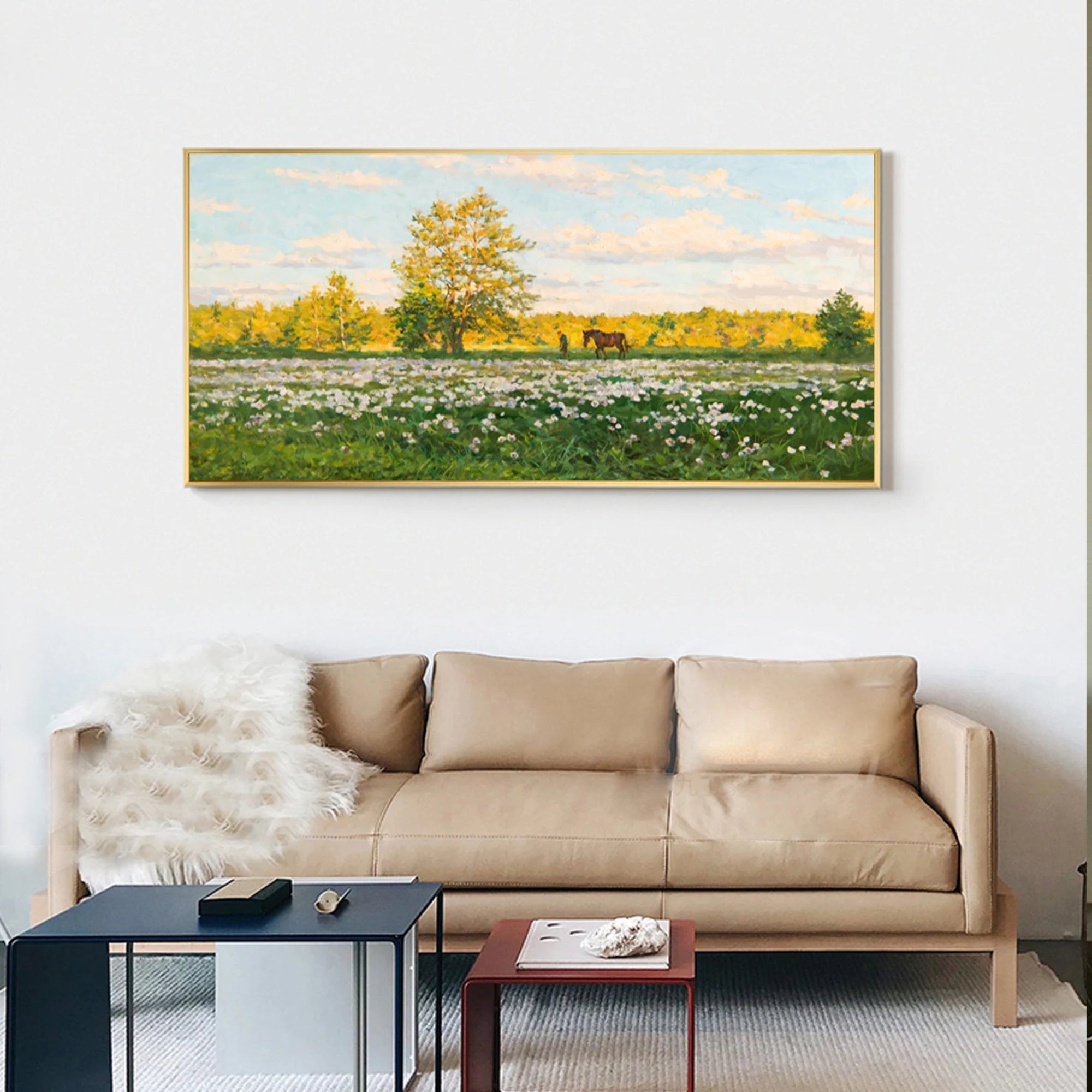 Rustic-style handmade painting featuring a green field, blooming flowers, and distant horse near trees.
