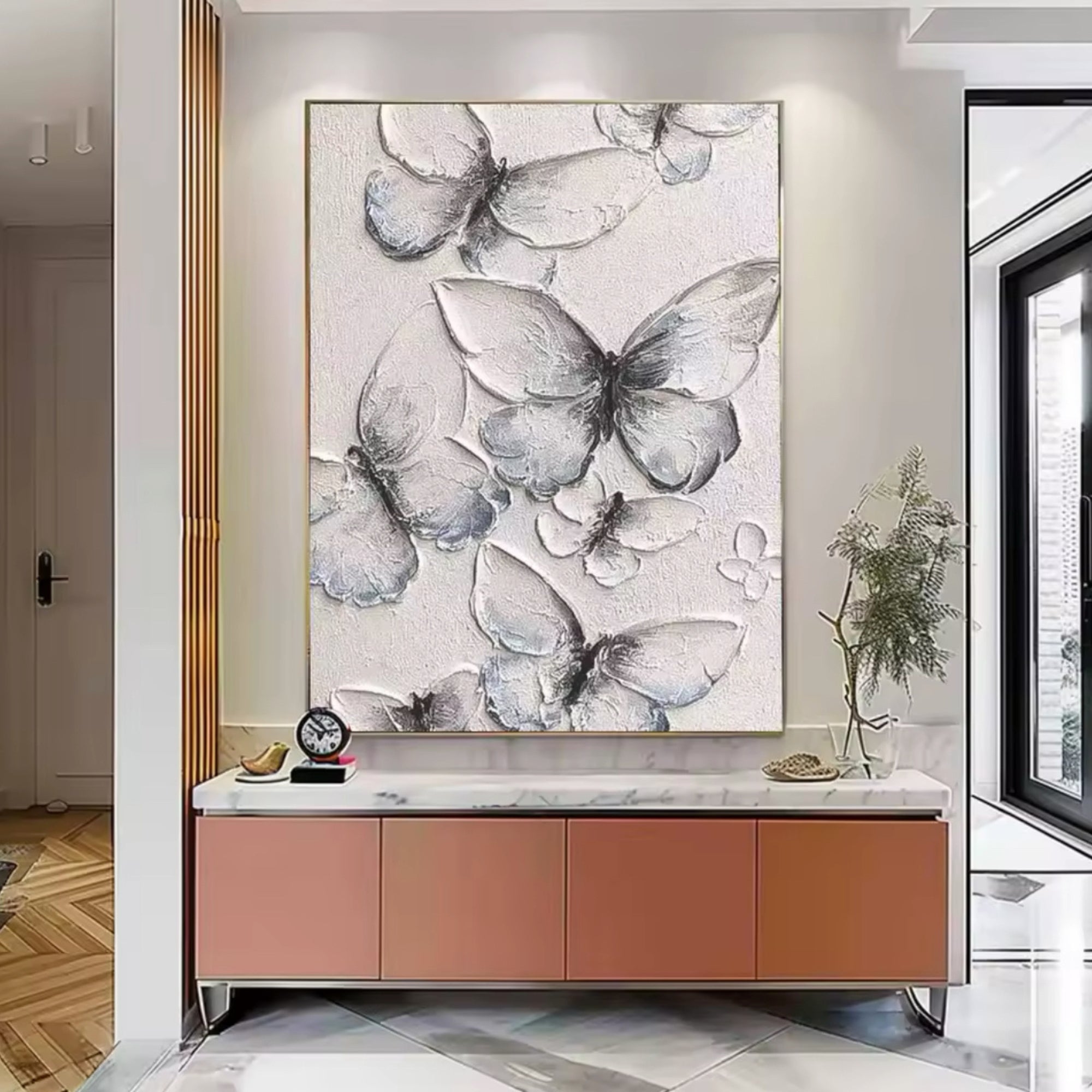 Artisan butterfly painting blends beautifully with botanical wallpaper in nature-themed home settings.