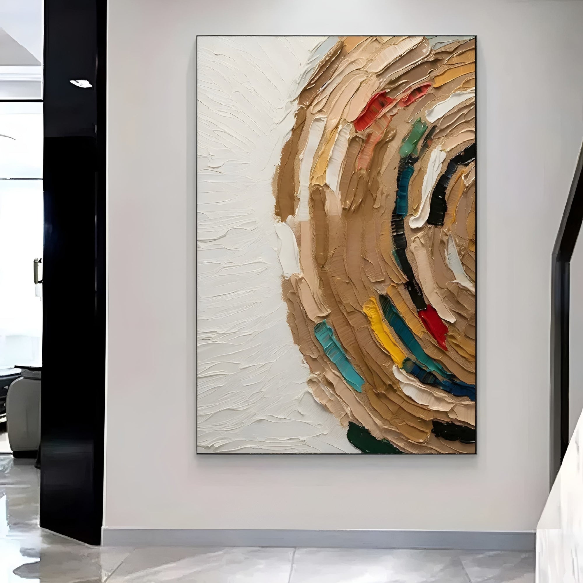 Contemporary art piece showcasing a dynamic, circular swirl of earthy tones mixed with splashes of primary colors, displayed above a clean white sofa.