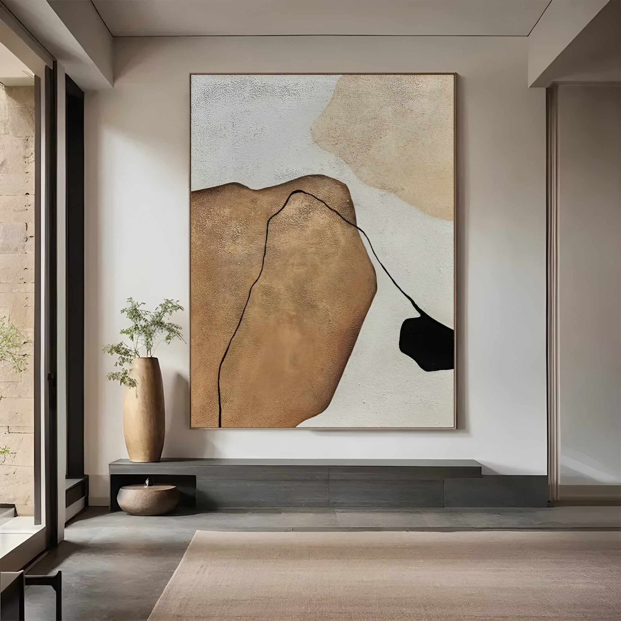 Hand-painted contemporary abstract wall art featuring organic shapes in brown, beige, and black, styled in a luxury interior.