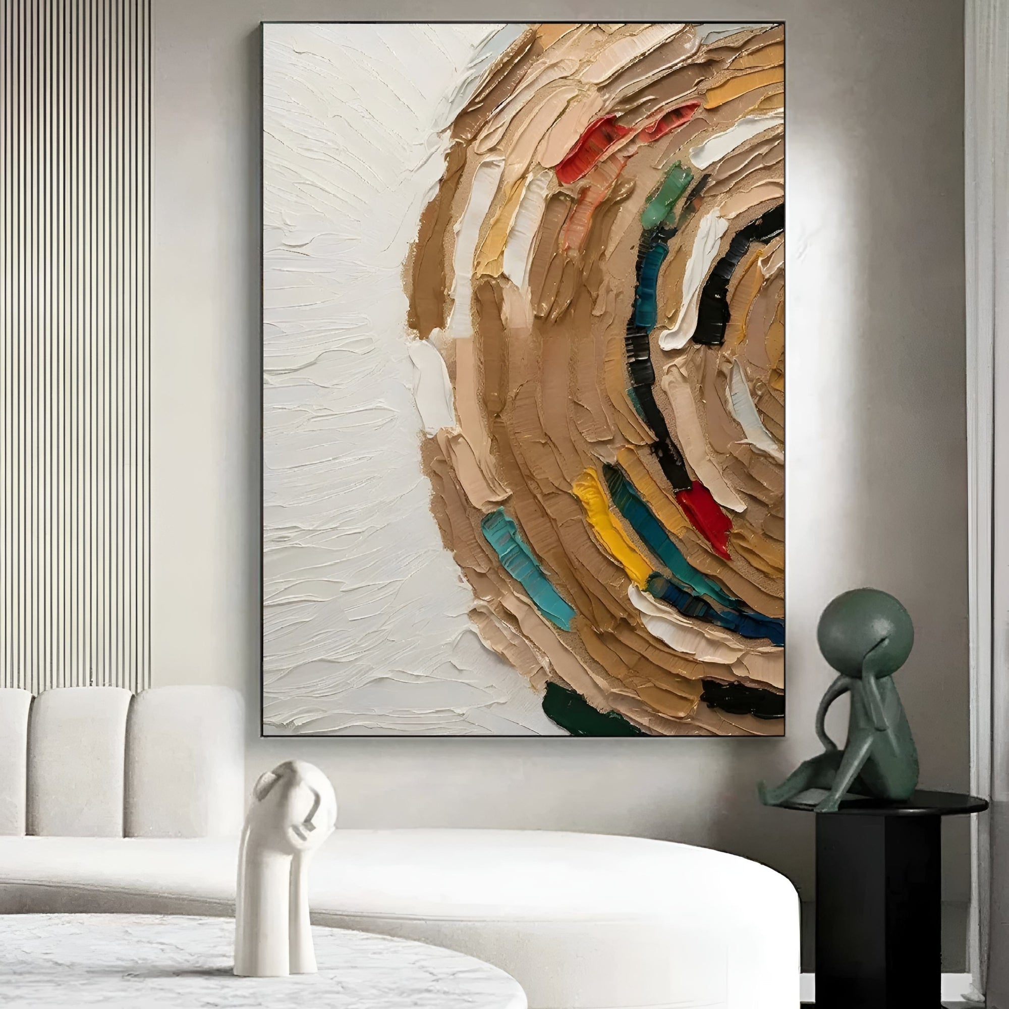 Modern living room with a textured abstract painting featuring swirling beige tones accented with vivid teal, red, yellow, and black strokes against a white background.