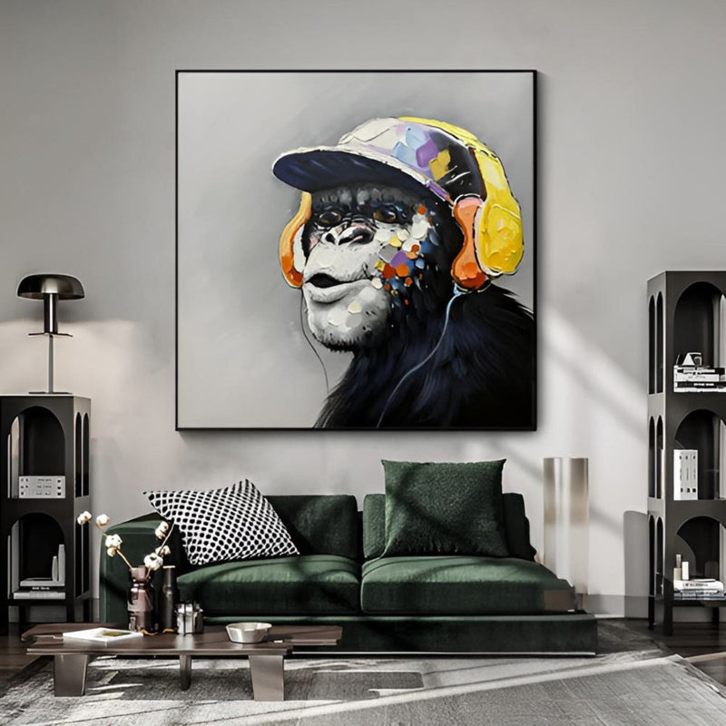 Funky chimpanzee art with cap and headphones, ideal handmade wall piece for contemporary living rooms.