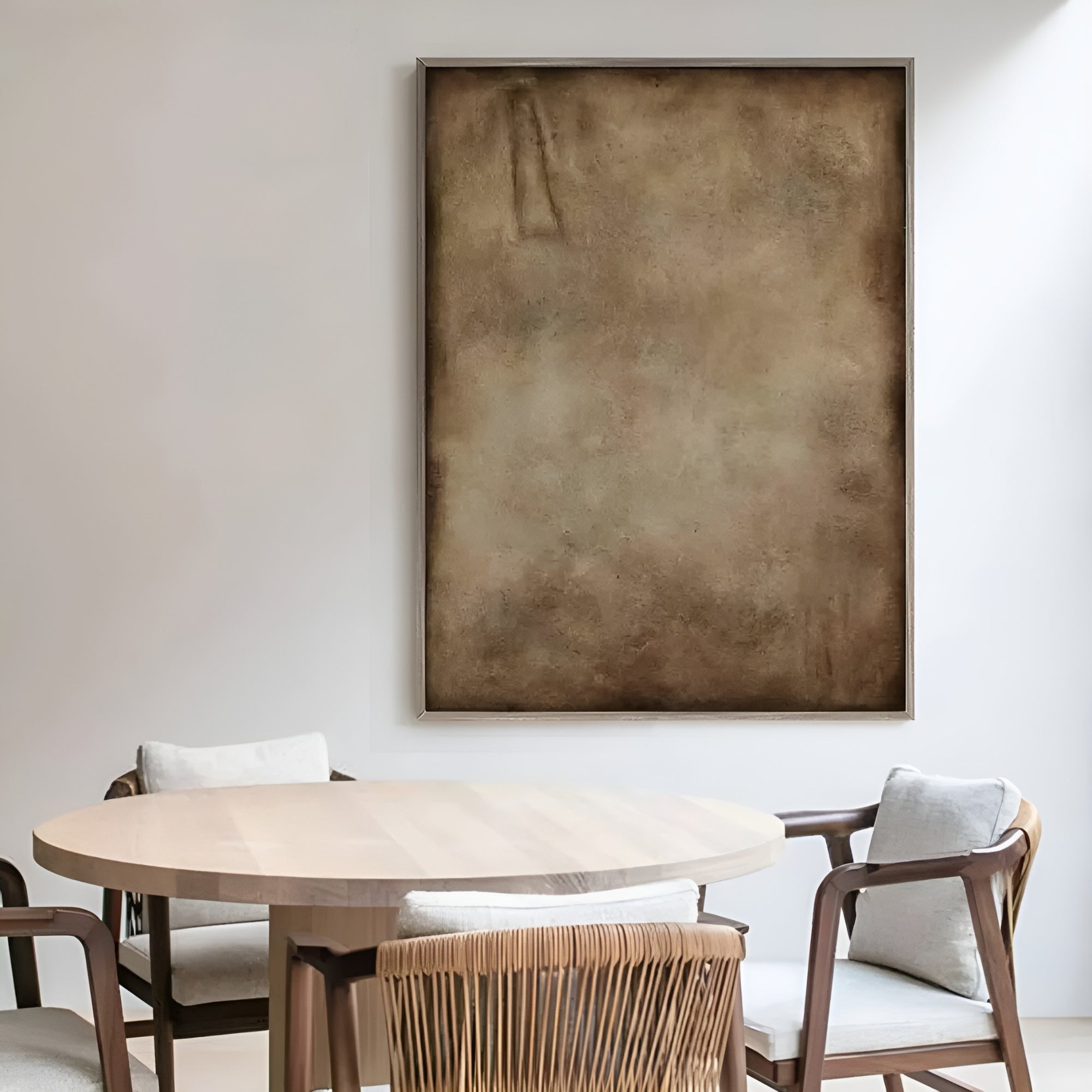 Muted brown abstract artwork in a cozy setting, creating a sophisticated and timeless atmosphere in a contemporary home