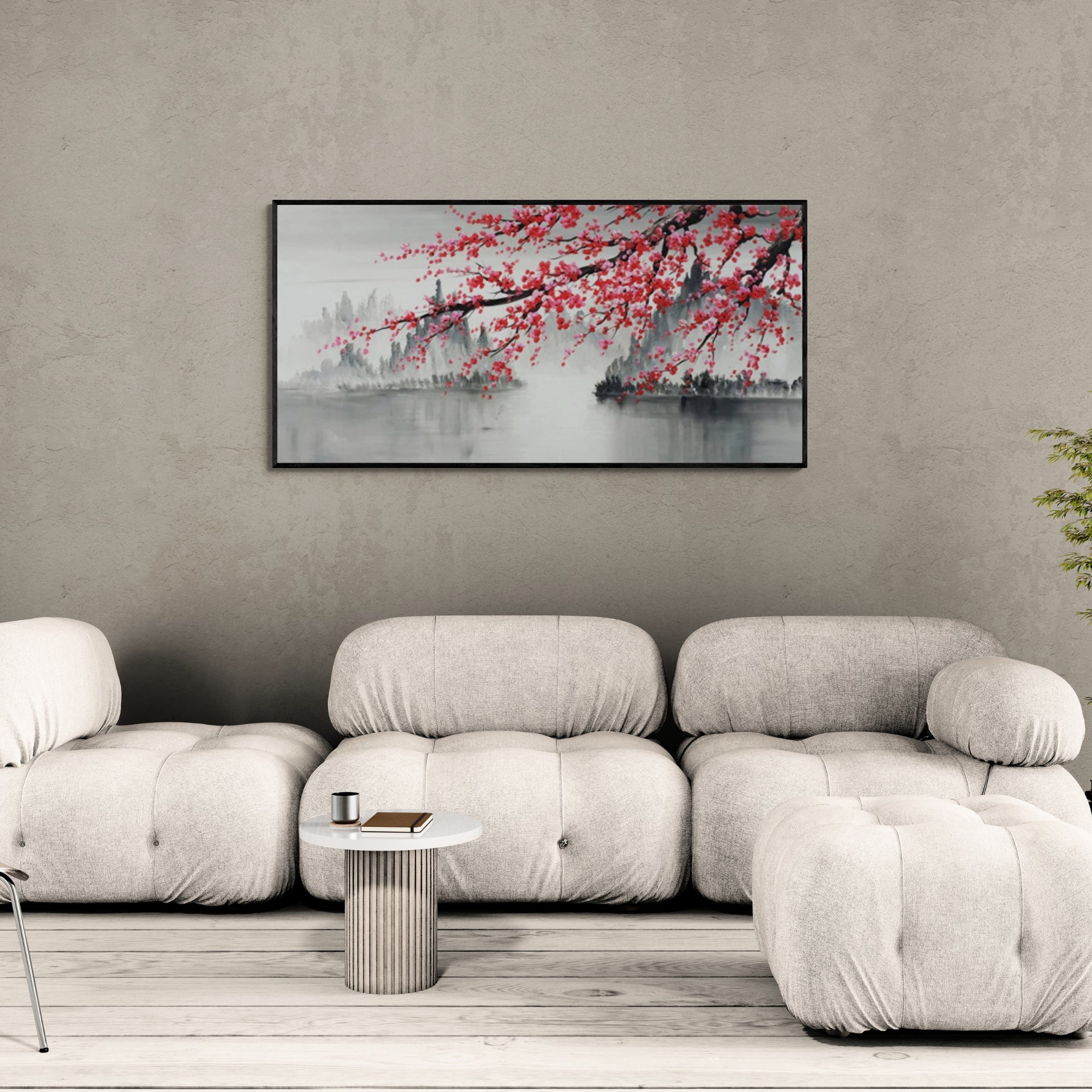 Framed cherry blossom artwork in neutral-toned living room with soft seating