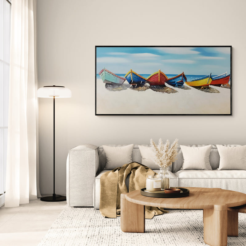 Handmade oil painting of colorful boats resting on a sandy beach under a clear blue sky.