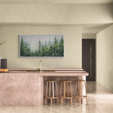 Moody forest wall art showcasing mist-covered treetops in varying shades of green and grey.