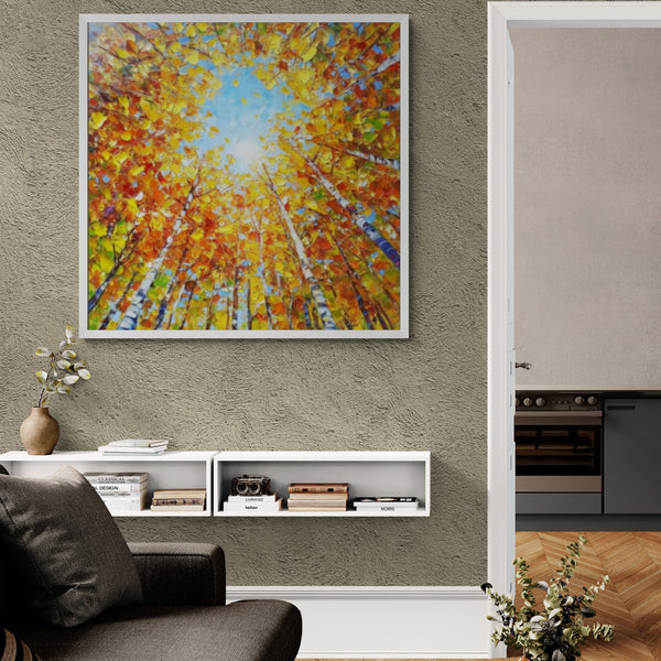 Vibrant canopy forest artwork showcasing a radiant burst of fall colors contrasted with sky blue, drawing the eye upward. A stunning statement piece for entryways, reading nooks, or modern interiors.