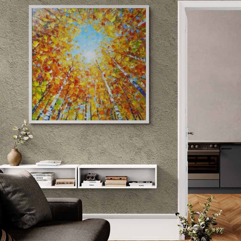 Vibrant canopy forest artwork showcasing a radiant burst of fall colors contrasted with sky blue, drawing the eye upward. A stunning statement piece for entryways, reading nooks, or modern interiors.