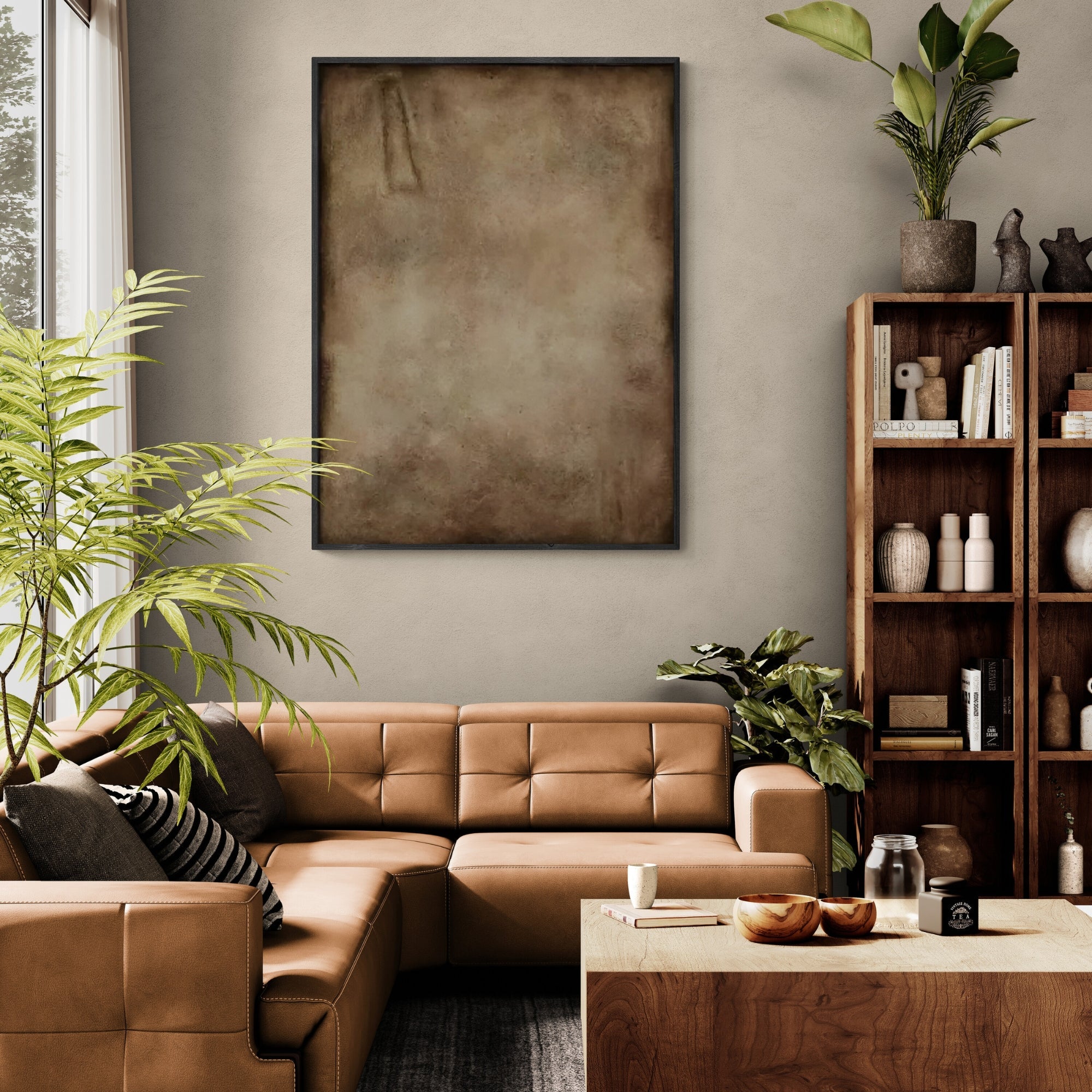 Handmade abstract artwork with a rustic patina effect, framed in a sleek gold border and hung in a modern dining space