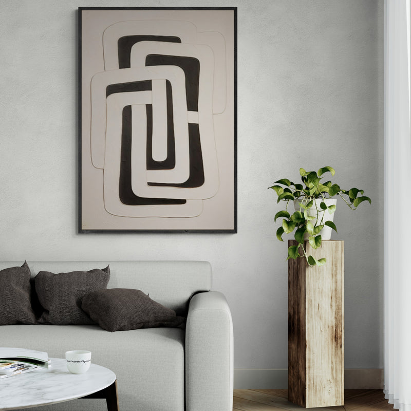 Minimalist geometric black and white wall art in modern living room – A striking abstract painting featuring interwoven black and white shapes, adding a sophisticated touch to a contemporary interior.